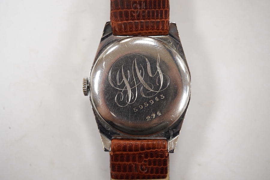 A gentlemen's mid 20th century stainless steel Rolco manual wind wrist watch, with Arabic dial, the case back with engraved monogram and numbered 595943 over 274, case diameter 29mm, on a later associated leather strap.